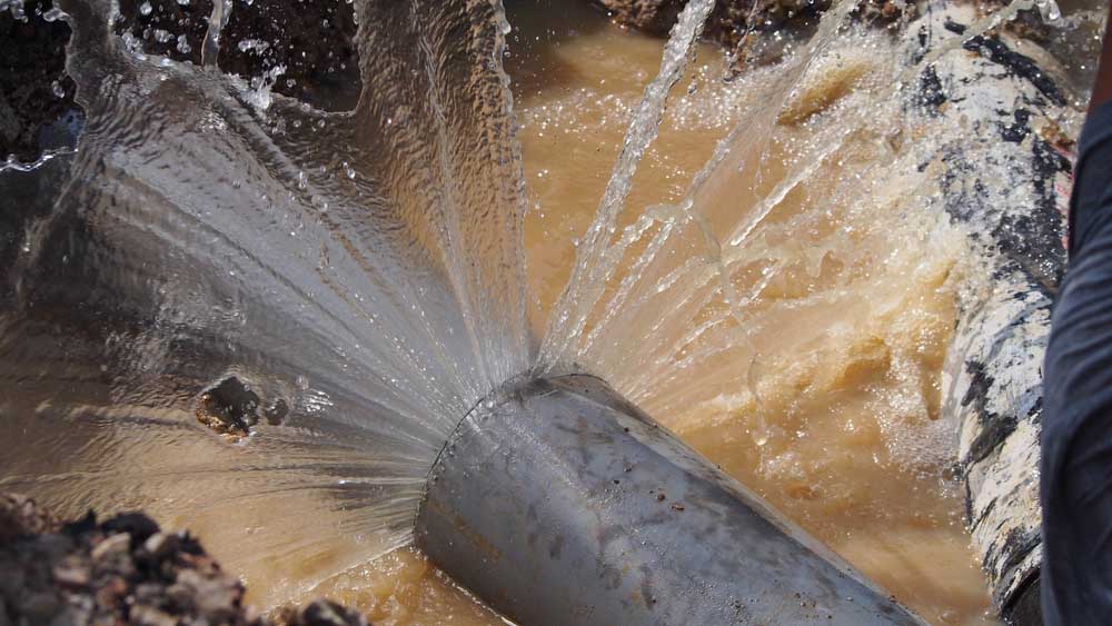 Water gushing out of a busted pipe
